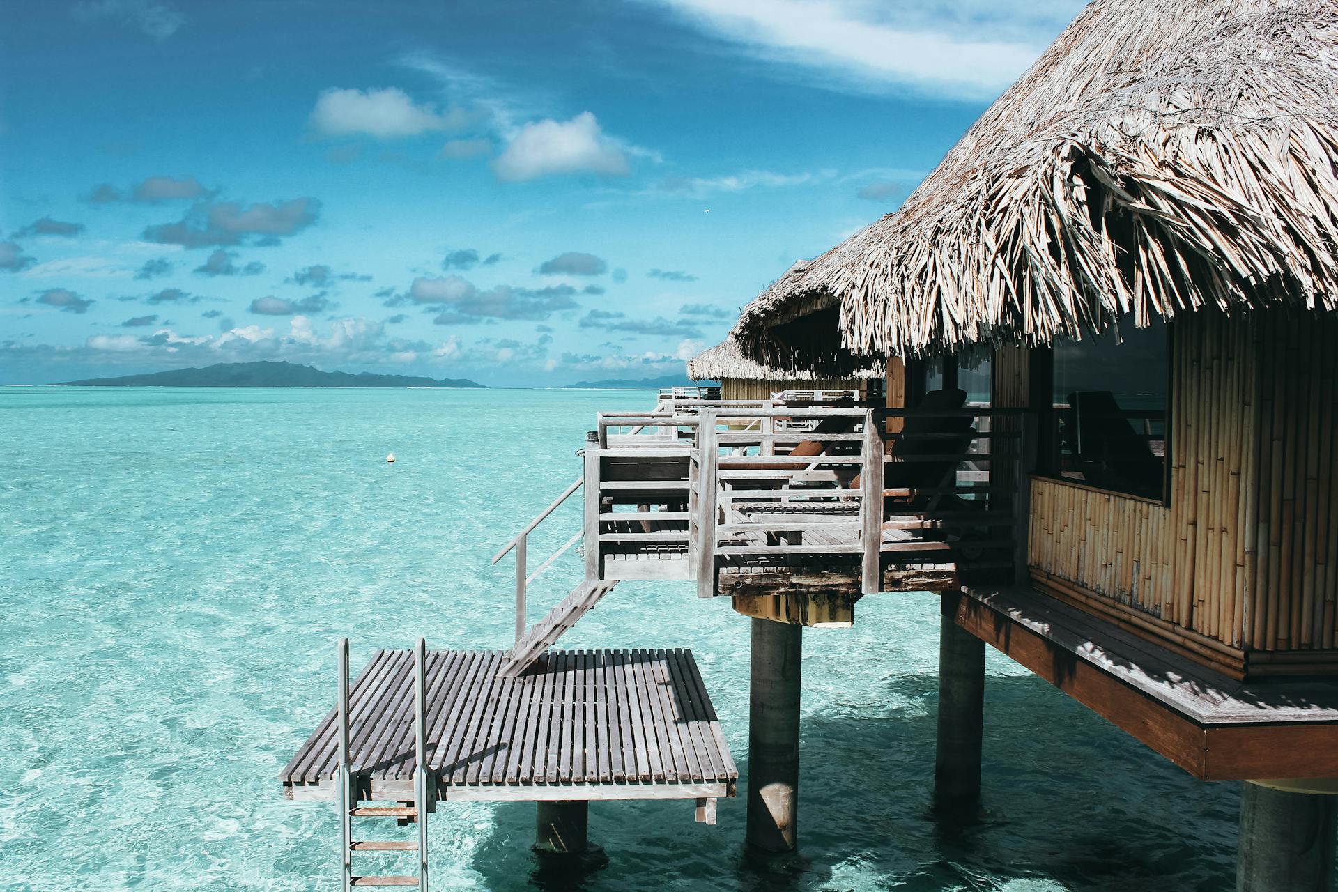 A cottage on top of a body of water